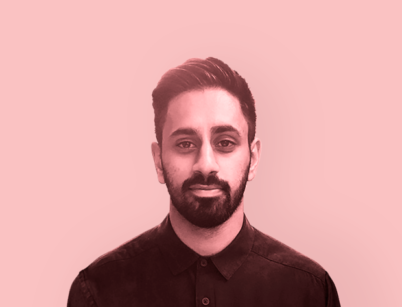 A monochrome image of the head and shoulders of Manny Dhanda with a pink filter